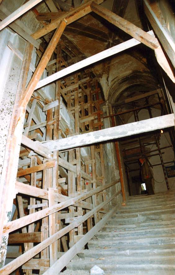 Central staircase propped before restoration